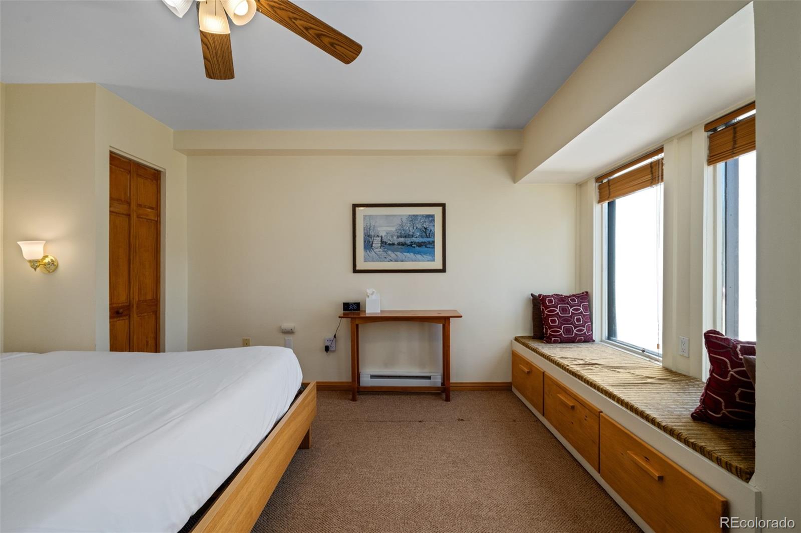 1800 Burgess Creek Road, Unit 205 Steamboat Springs, CO 80487 - Photo 22 of 28 a spacious bedroom with a bed and window