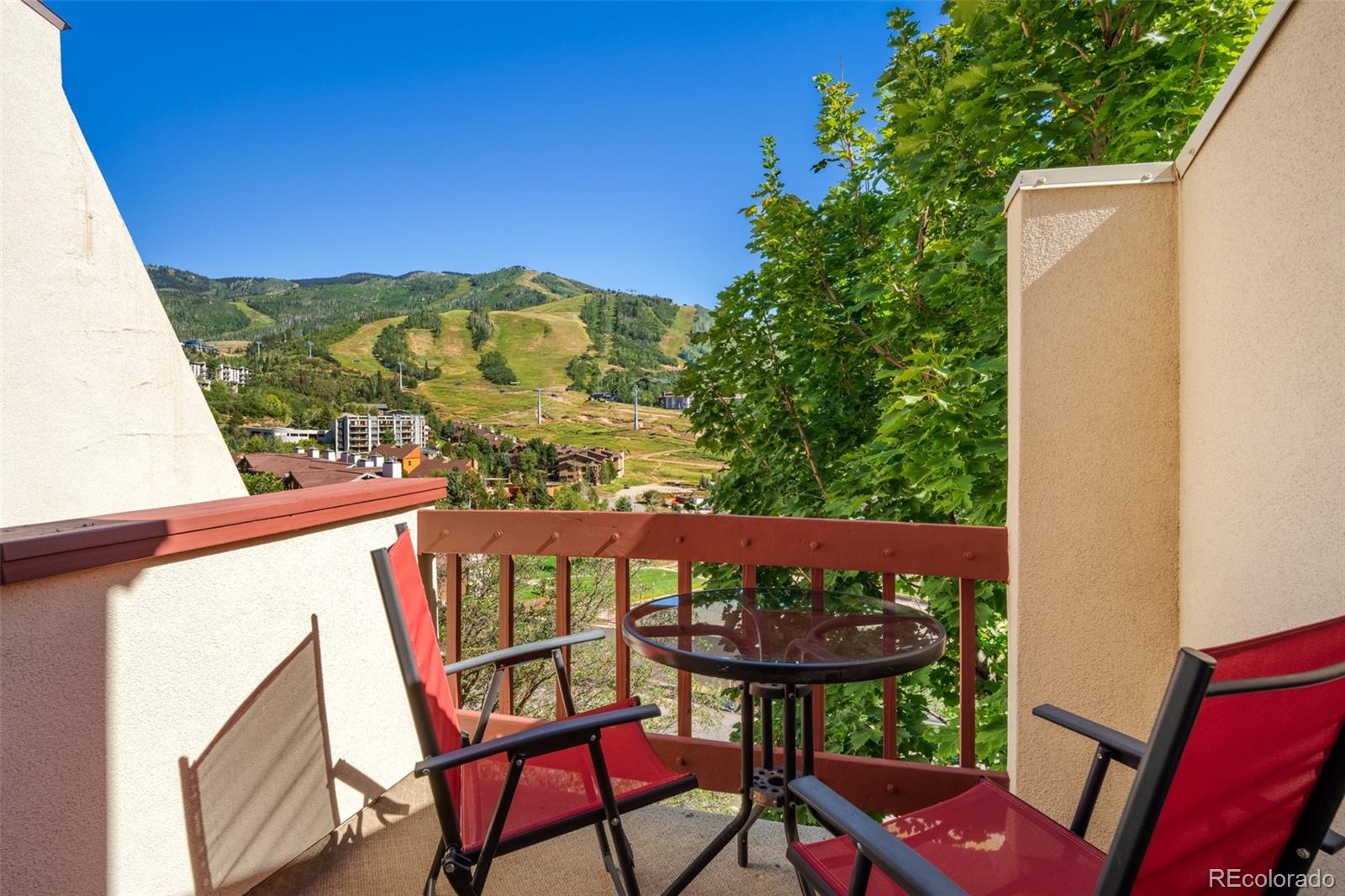 1800 Burgess Creek Road, Unit 205 Steamboat Springs, CO 80487 - Photo 5 of 28 a view of a chairs and table in the balcony