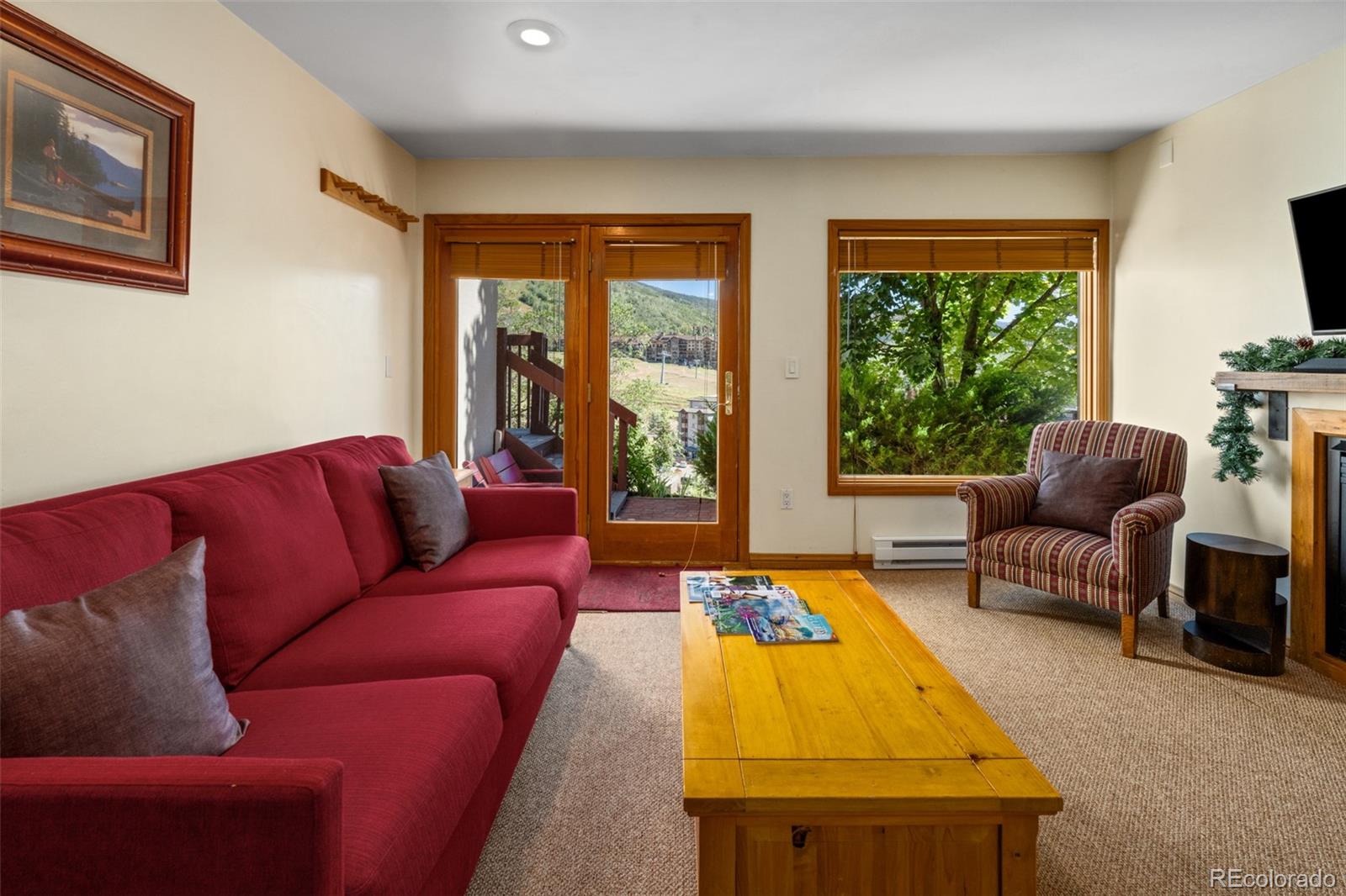 1800 Burgess Creek Road, Unit 205 Steamboat Springs, CO 80487 - Photo 10 of 28 a living room with furniture and a large window