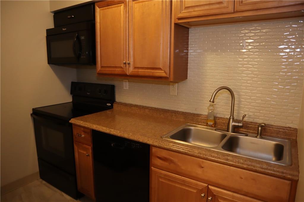 329 Ridge Point Circle, Unit 34 Bridgeville, PA 15017 - Photo 5 of 18 a close view of sink and tap