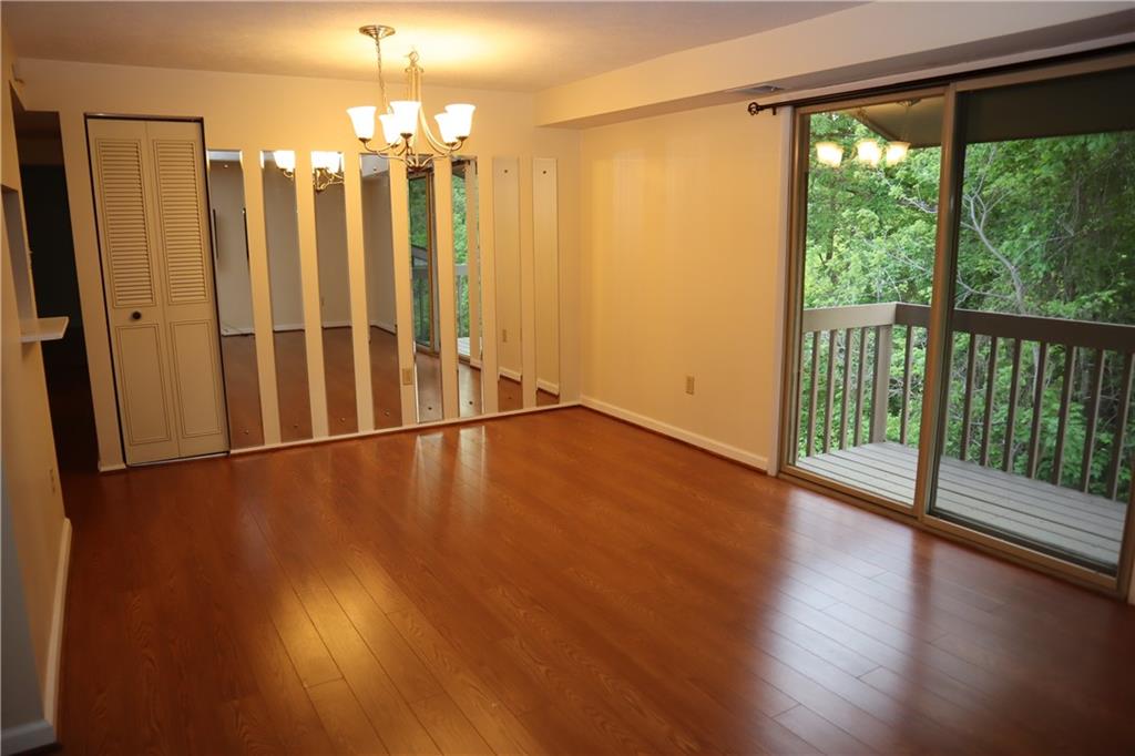329 Ridge Point Circle, Unit 34 Bridgeville, PA 15017 - Photo 8 of 18 a view of a room with wooden floor and large window