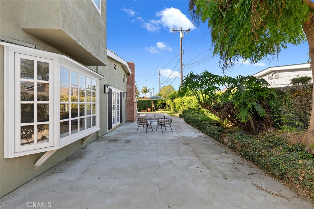 17131 Autumn Huntington Beach, CA 92647 - Photo 1 of 36 a view of a porch with chairs and potted plants