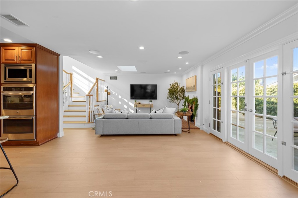 17131 Autumn Huntington Beach, CA 92647 - Photo 11 of 36 a living room with furniture and flat screen tv