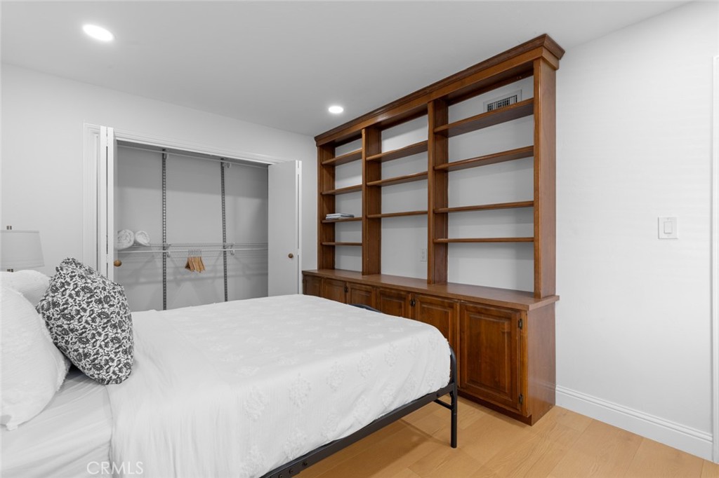 17131 Autumn Huntington Beach, CA 92647 - Photo 14 of 36 a bedroom with a bed and a large window