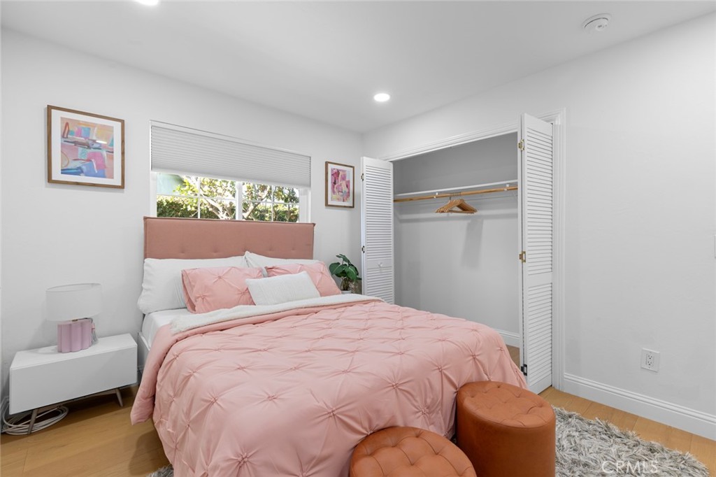 17131 Autumn Huntington Beach, CA 92647 - Photo 16 of 36 a bedroom with a bed and a couch