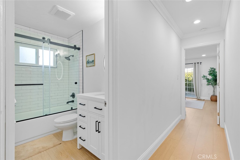 17131 Autumn Huntington Beach, CA 92647 - Photo 17 of 36 a bathroom with a sink a toilet and shower