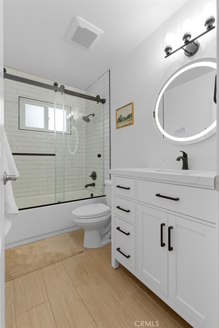 17131 Autumn Huntington Beach, CA 92647 - Photo 18 of 36 a bathroom with a sink a toilet and shower