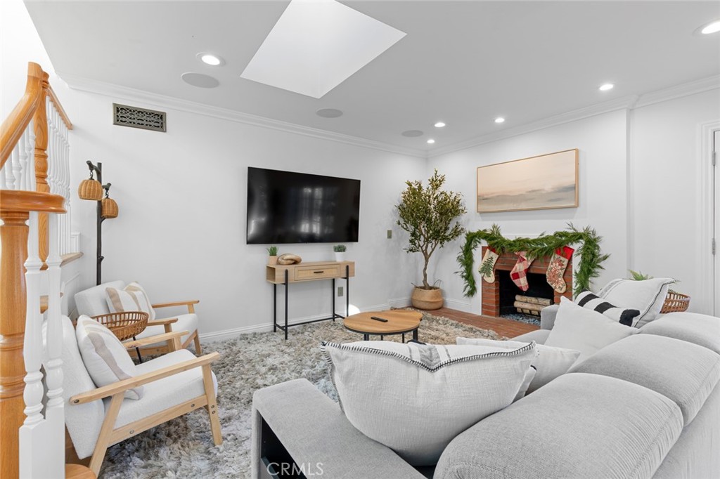 17131 Autumn Huntington Beach, CA 92647 - Photo 2 of 36 a living room with furniture and a flat screen tv