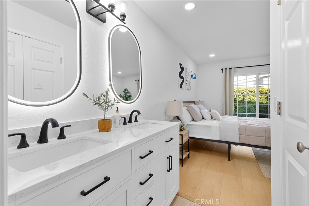 17131 Autumn Huntington Beach, CA 92647 - Photo 22 of 36 a bathroom with a sink and a mirror