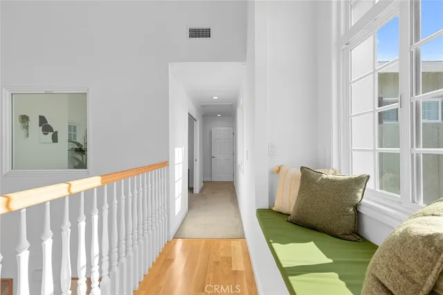 a view of living room with furniture and a potted plant