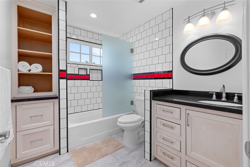 17131 Autumn Huntington Beach, CA 92647 - Photo 27 of 36 a bathroom with a sink a toilet and a shower