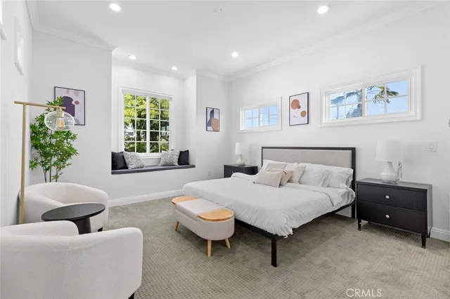 a bedroom with a bed and a chair