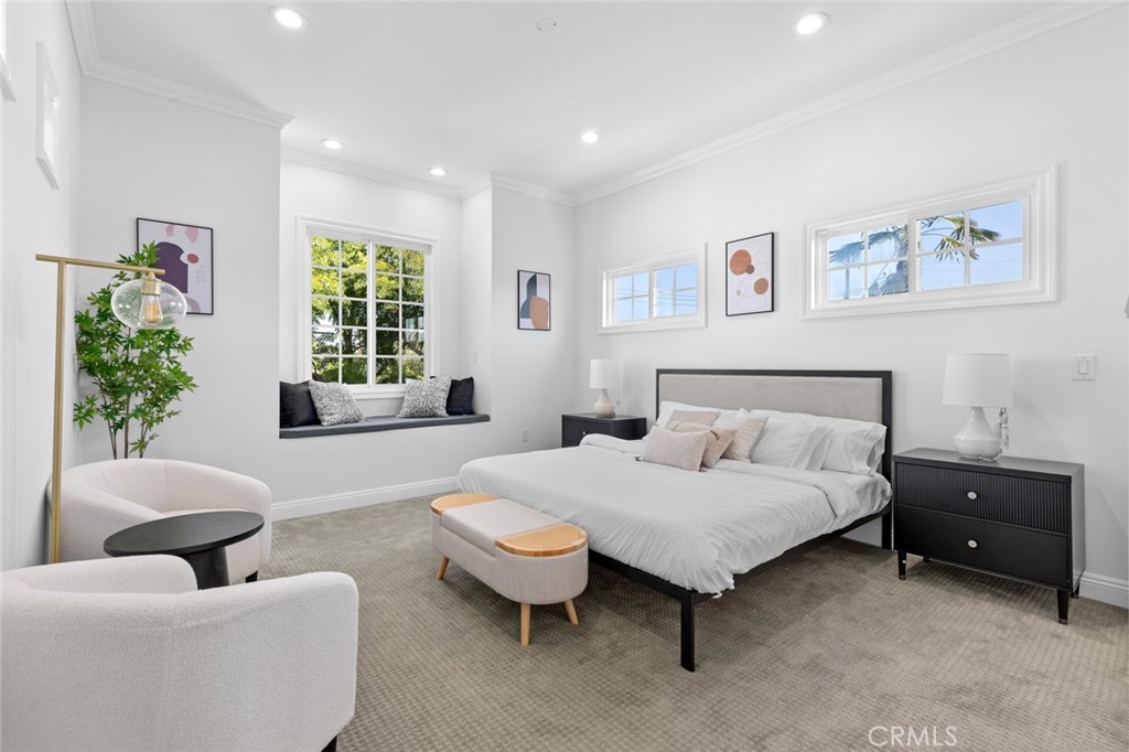 17131 Autumn Huntington Beach, CA 92647 - Photo 28 of 36 a bedroom with a bed and a couch