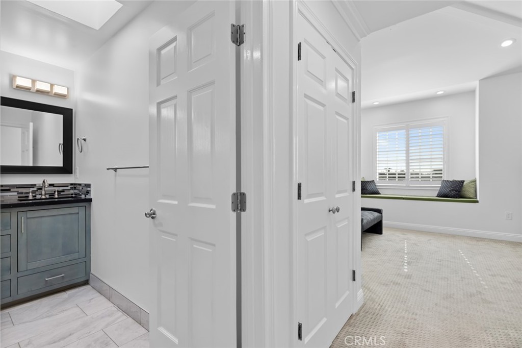 17131 Autumn Huntington Beach, CA 92647 - Photo 30 of 36 a kitchen with cabinets and a stove