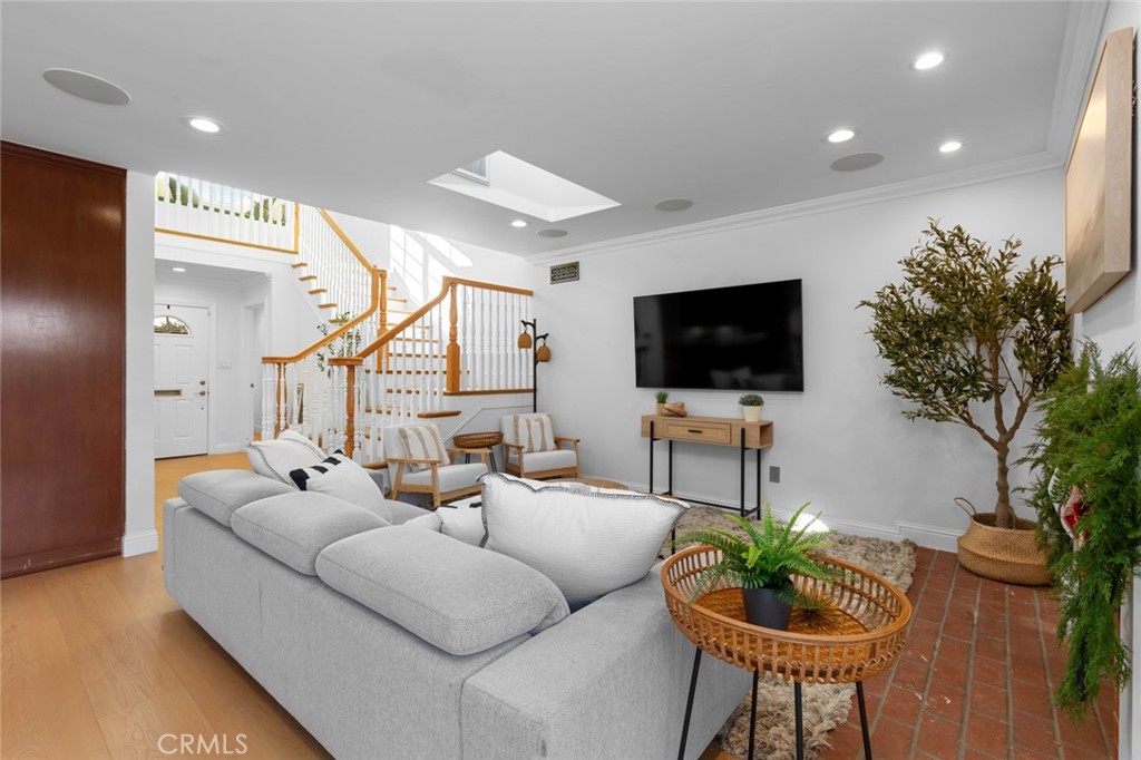 17131 Autumn Huntington Beach, CA 92647 - Photo 3 of 36 a living room with furniture and a flat screen tv