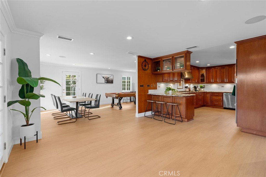 17131 Autumn Huntington Beach, CA 92647 - Photo 4 of 36 a living room with furniture kitchen view and a potted plant