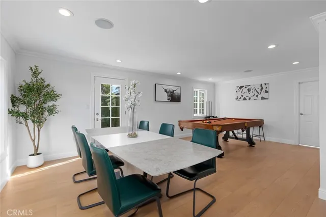 a view of a dining room with furniture and a potted plant