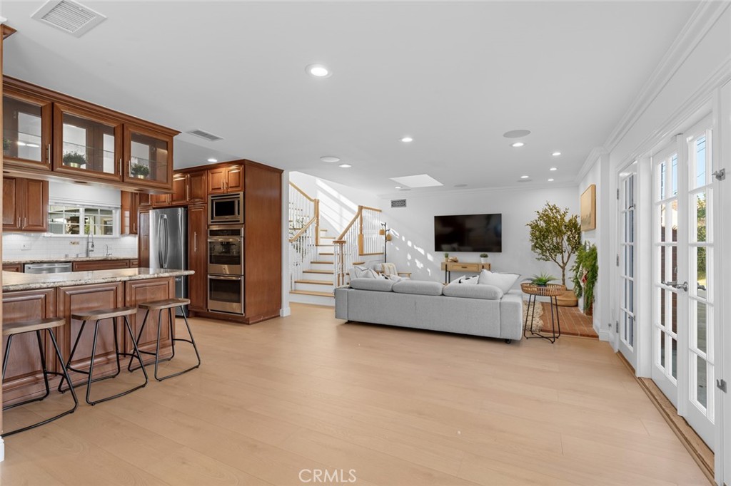 17131 Autumn Huntington Beach, CA 92647 - Photo 10 of 36 a living room with furniture and a flat screen tv