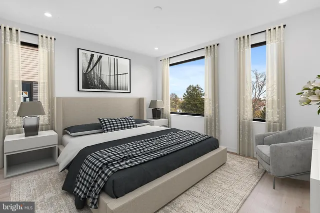 a bedroom with a large bed and a couch