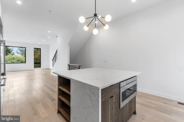 a view of a kitchen with a sink and dishwasher