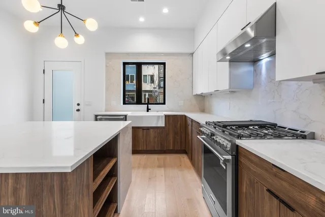 a kitchen with a stove and a sink
