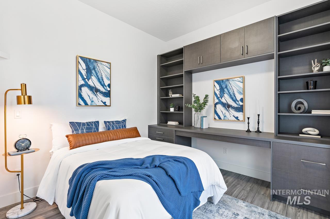 599 West Warren Street Boise, ID 83706 - Photo 30 of 41 Bedroom featuring wood-finish flooring and light-toned walls