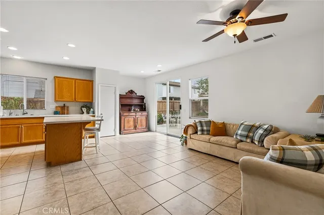 a large white kitchen with a sink and cabinets