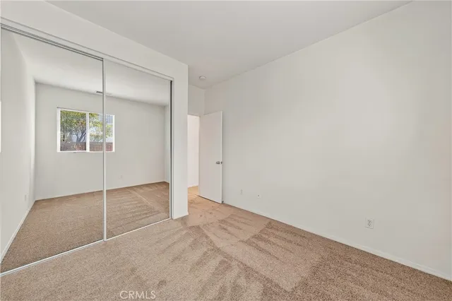 a spacious bathroom with a tub sink and mirror