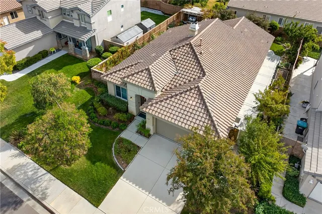 an aerial view of a house with a yard garden and staircase