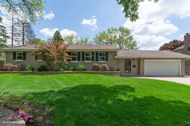 417 Warren Road Glenview, IL 60025 - Photo 1 of 24 a front view of house with yard and green space