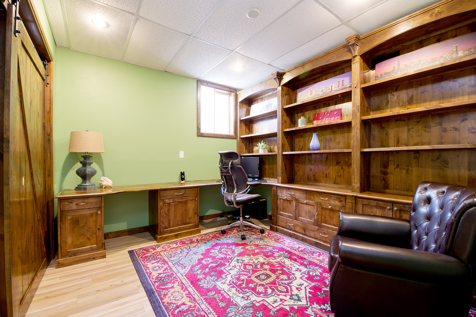 417 Warren Road Glenview, IL 60025 - Photo 19 of 24 a room with furniture wooden floor and a rug