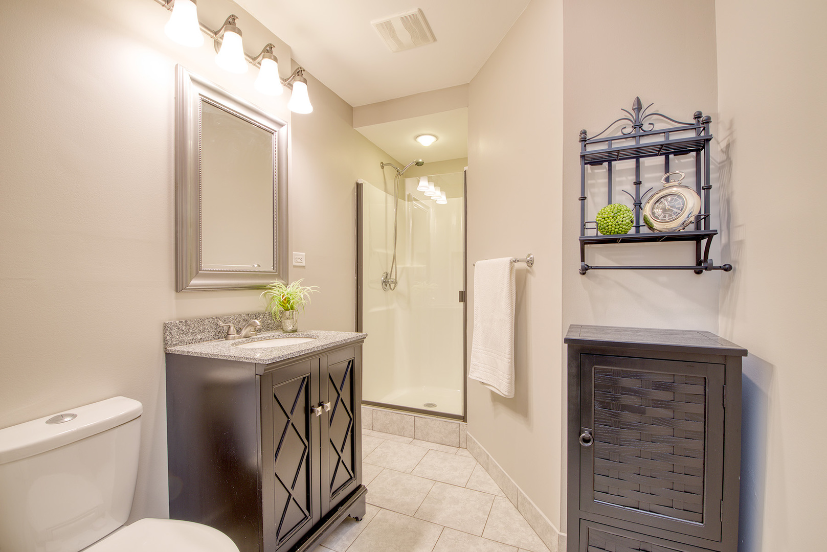 417 Warren Road Glenview, IL 60025 - Photo 20 of 24 a bathroom with a toilet a sink and a mirror