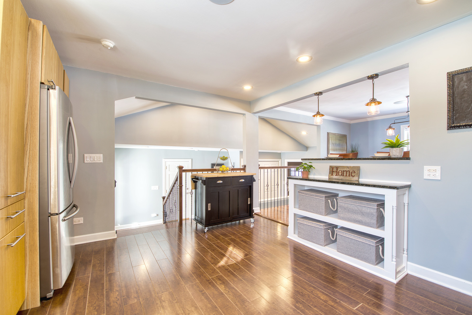 417 Warren Road Glenview, IL 60025 - Photo 7 of 24 a kitchen with a cabinets and wooden floor