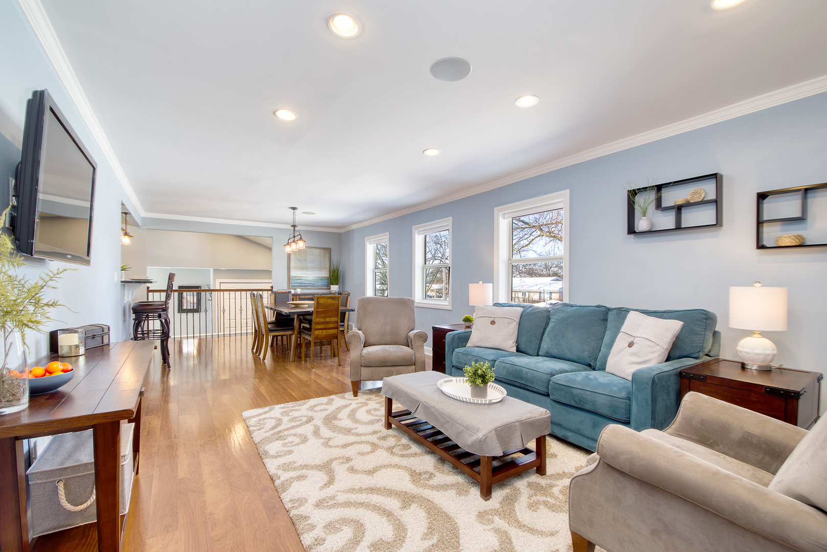 417 Warren Road Glenview, IL 60025 - Photo 9 of 24 a living room with furniture and a flat screen tv