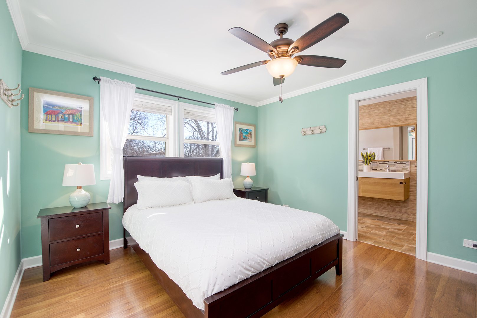 417 Warren Road Glenview, IL 60025 - Photo 10 of 24 a bedroom with a large bed and a ceiling fan