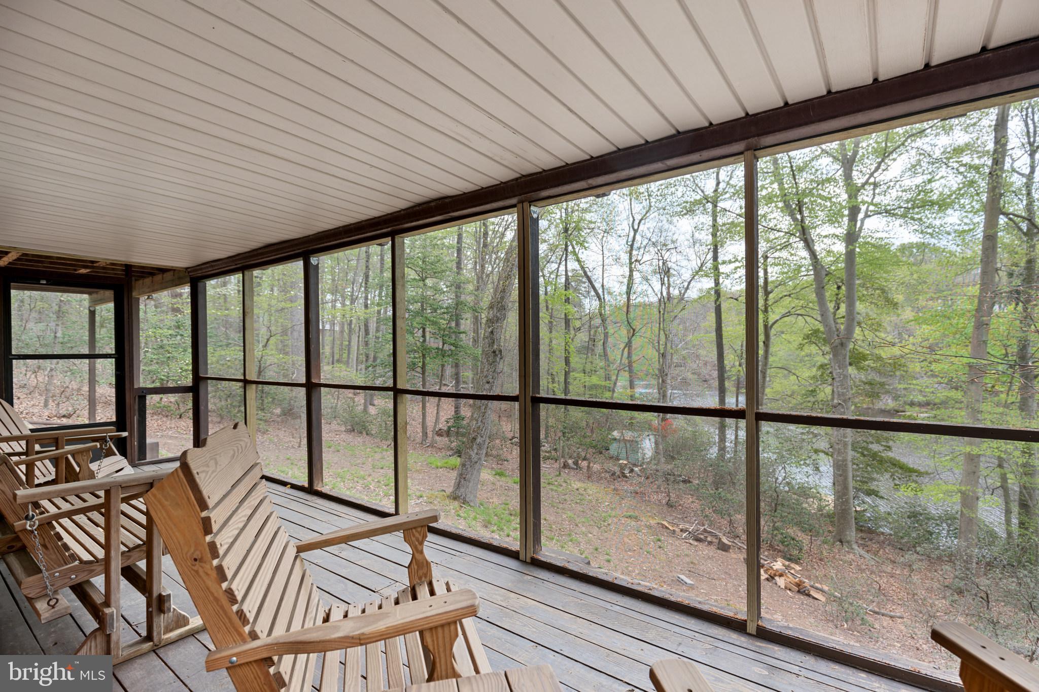 615 Running Fox Road Lusby, MD 20657 - Photo 28 of 30 Screened in lower deck!