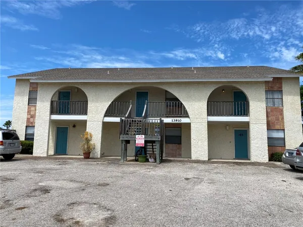 a front view of a house with parking