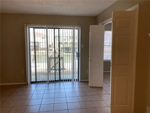 a view of empty room with windows