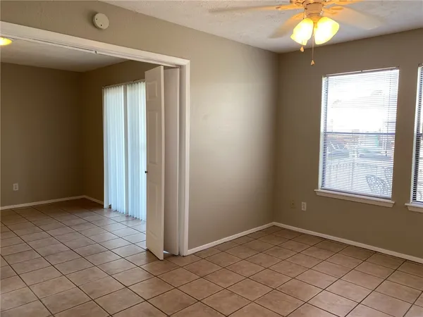 a view of an empty room and window