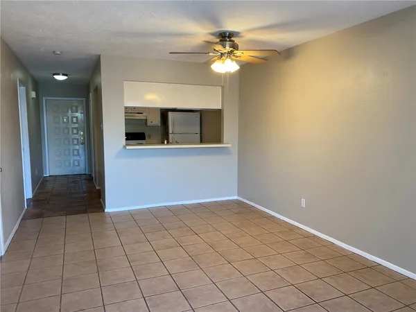a view of a hallway with a chandelier
