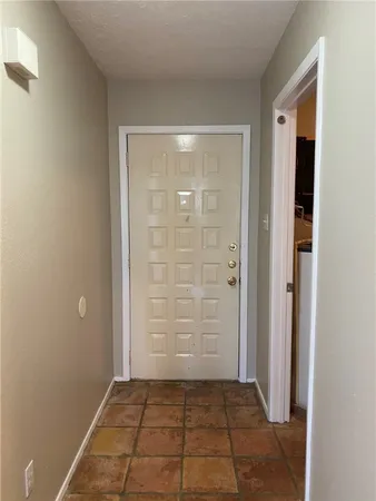 a view of a balcony with furniture