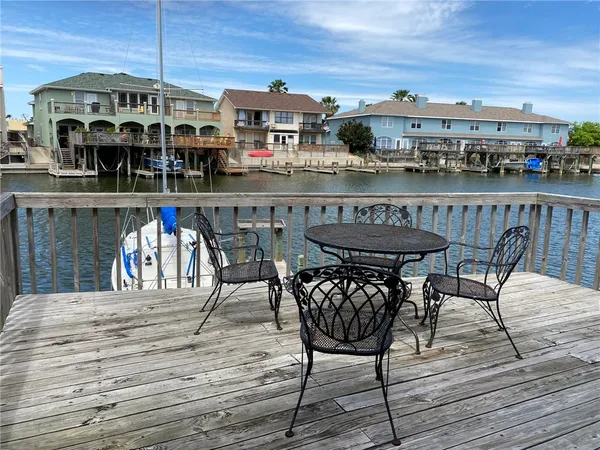 a view of a car parked in front of garage