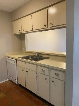 a view of cabinets and window