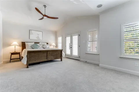 a bedroom with furniture and a window