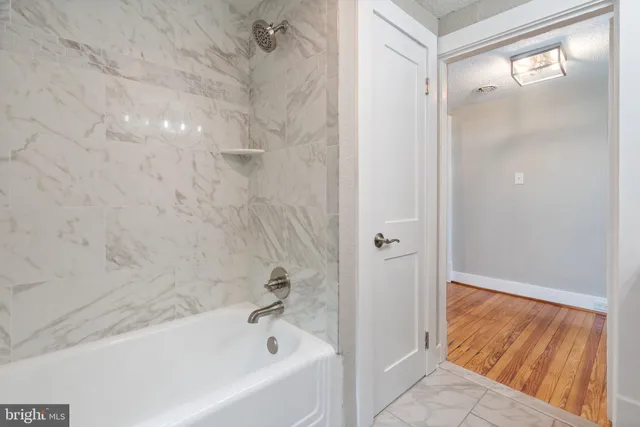 an aerial view of residential houses with outdoor space and street view