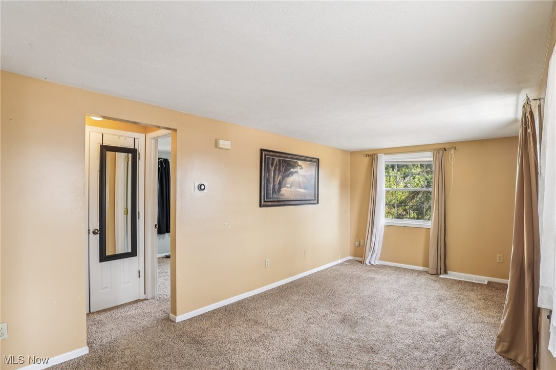 23 Lane Street Rittman, OH 44270 - Photo 28 of 34 Carpeted empty room featuring baseboards