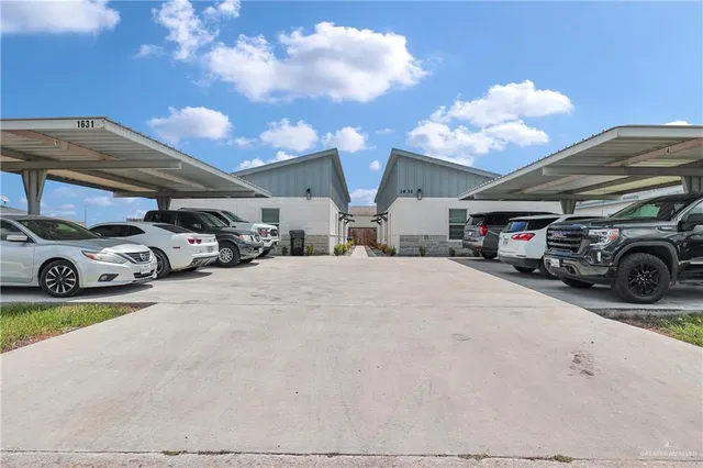 a view of parking with cars parked