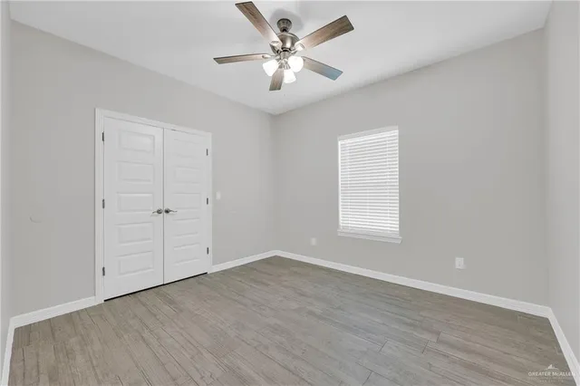 a bathroom with a toilet sink shower and mirror