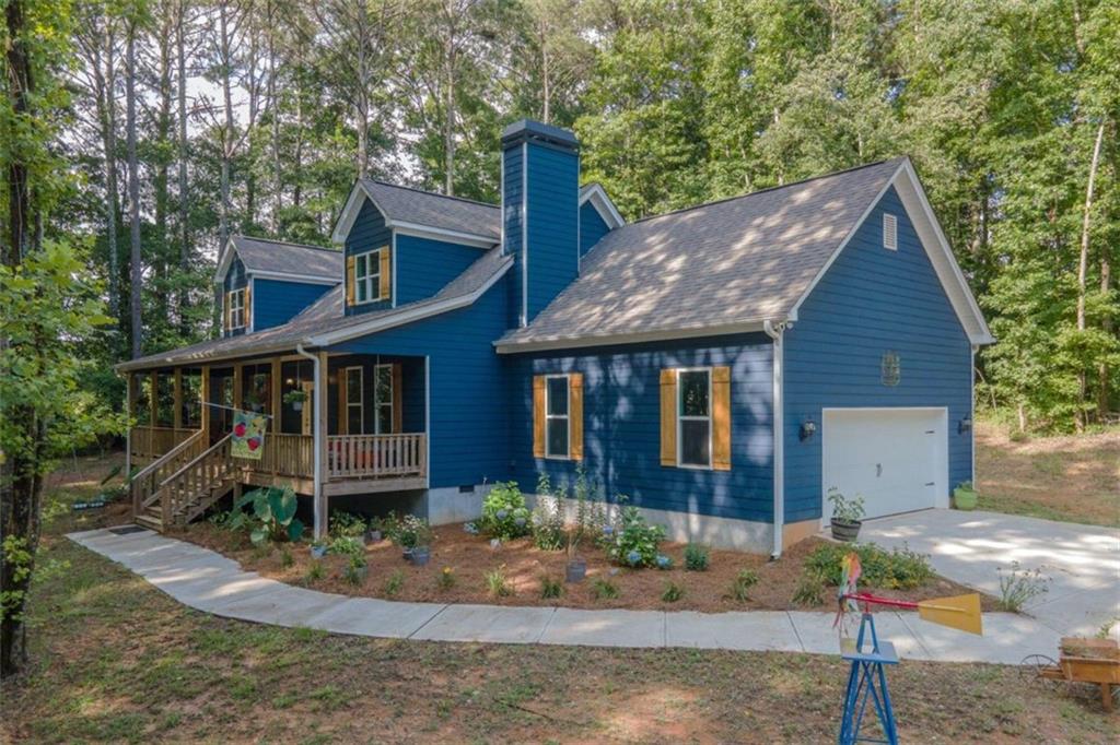 183 Agape Road Carrollton, GA 30116 - Photo 1 of 1 a front view of a house with garden