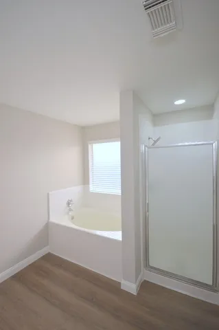 a view of bathroom and bathtub